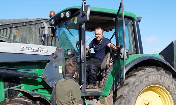 a man sitting on a tractor